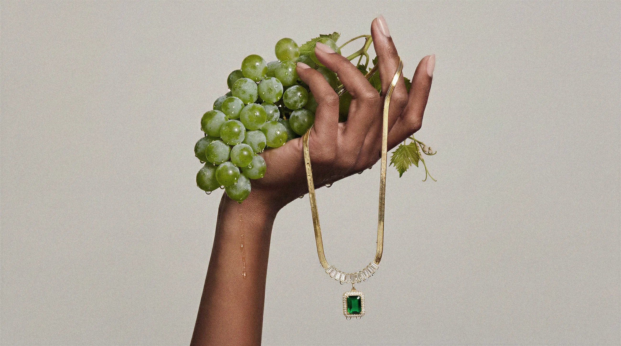 Lunielle herringbone necklace held with green grapes